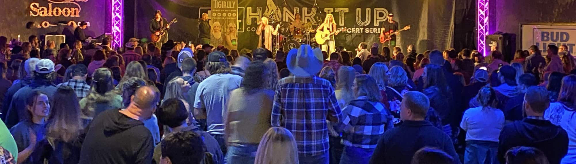 country concert with fans wearing cowboy hats Providence