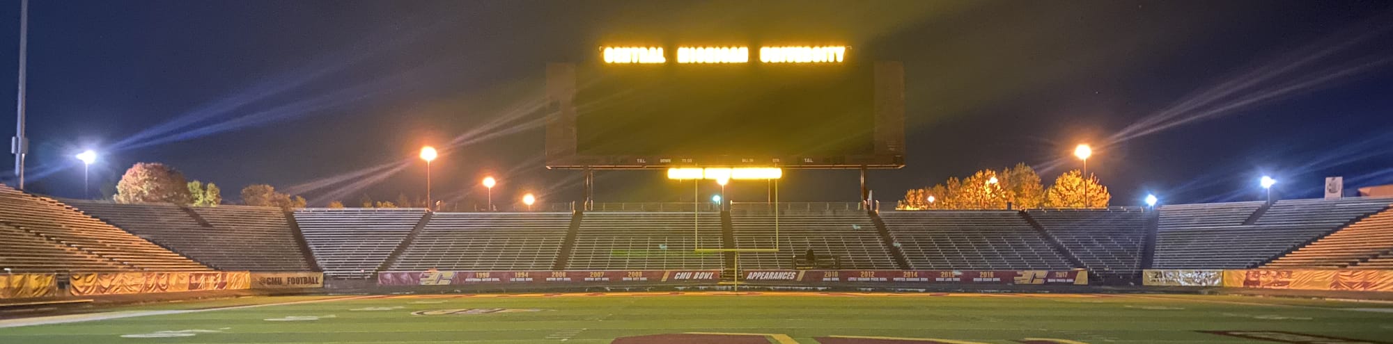 empty football stadium at night under the lights Providence