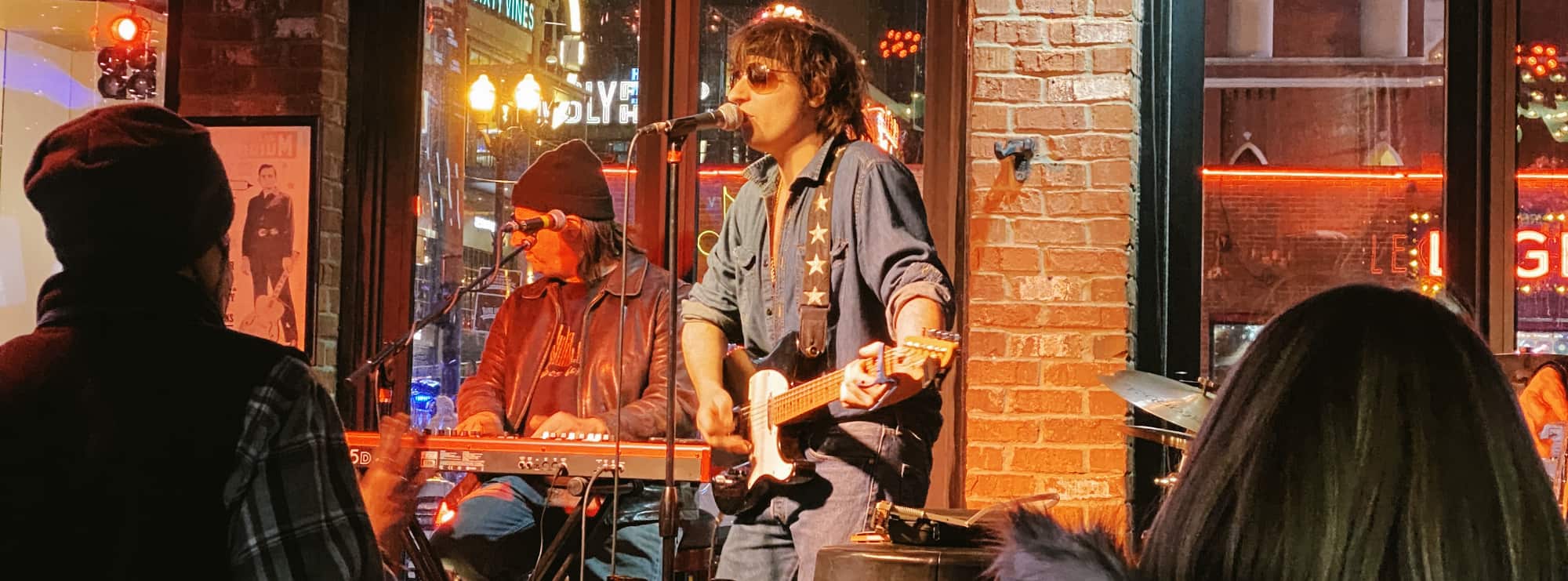 bar singer on guitar in Providence
